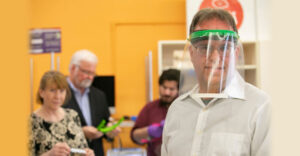 Stony Brook University staff wears 3D printed mask made in campus iCREATE lab.