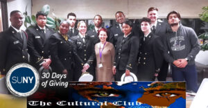 SUNY Maritime College cultural club students pose fr a picture in their uniforms.