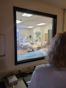 Mary Lee Berg, nursing faculty member at SUNY OCC, watches nursing students train from OCC's nursing observation room. 
