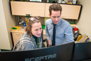 Two teachers working together at a computer