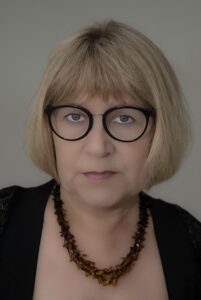 Headshot of Professor Anna Babinska with a neutral gray background 