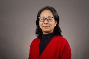 Headshot of professor Yubing Xie with a neutral gray background 
